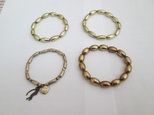 CZTERY BRANSOLETKI ELASTYCZNE Z KORALIKÓW W KOLORZE ZŁOTYM