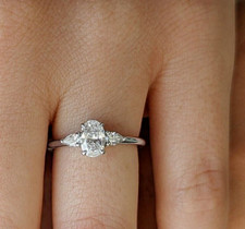 2 Ctw Oval Cut VVS1 Moissanite Three-Stone Engagement Ring 14k White Gold Plated