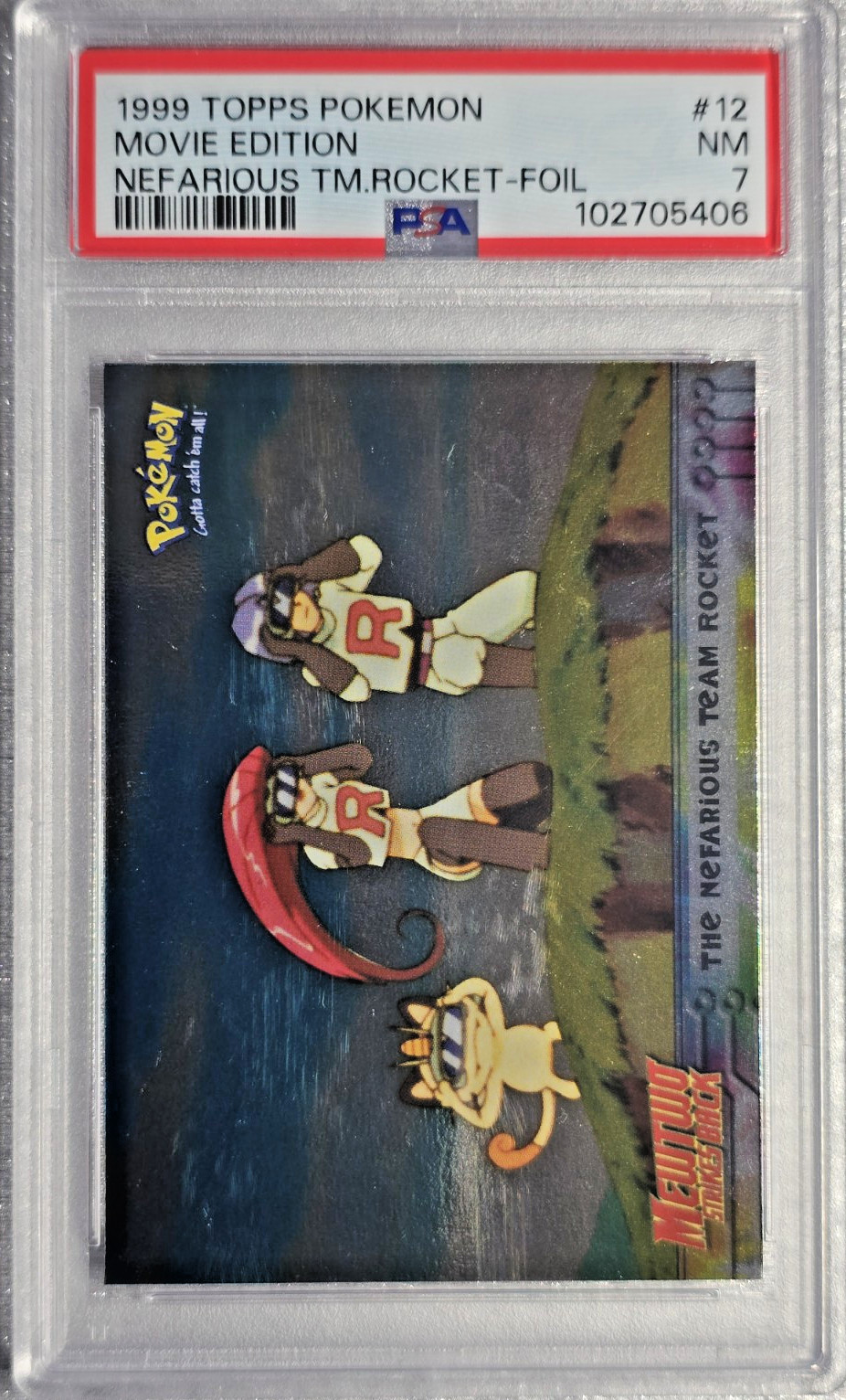 PSA 7 NM 1999 Topps Pokemon - Movie Edition ~ Nefarious Team Rocket ~ Foil - #12