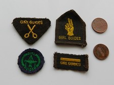 A COLLECTION of 4 MIXED VINTAGE GIRL GUIDES SEW-ON BADGES