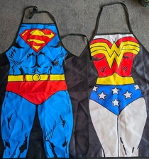Image of Superman and Superwoman Novelty Aprons. DC Comics