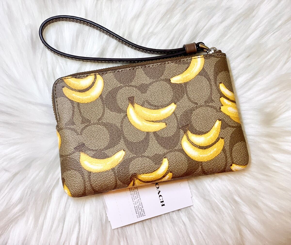COACH Corner Zip Wristlet In Signature Canvas With Banana COACH Corner Zip Wristlet In Signature Canvas With Banana