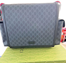 Gucci GG Supreme canvas diaper bag with multiple pockets, foldout changing pad