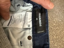 Pantalones de mezclilla DSQUARED2 para hombre calce ajustado azul lavado medio tiro medio desgastados A44