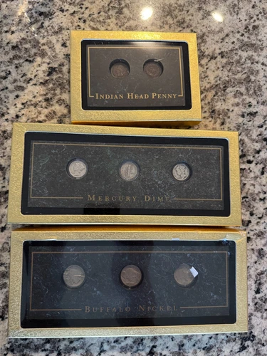 Buffalo Nickel's, Mercury Dime's and Indian Head Penny's in display cases