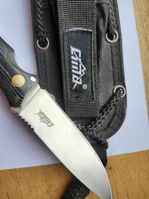 Knife cima t601 brand: cima knives. there is an armchair