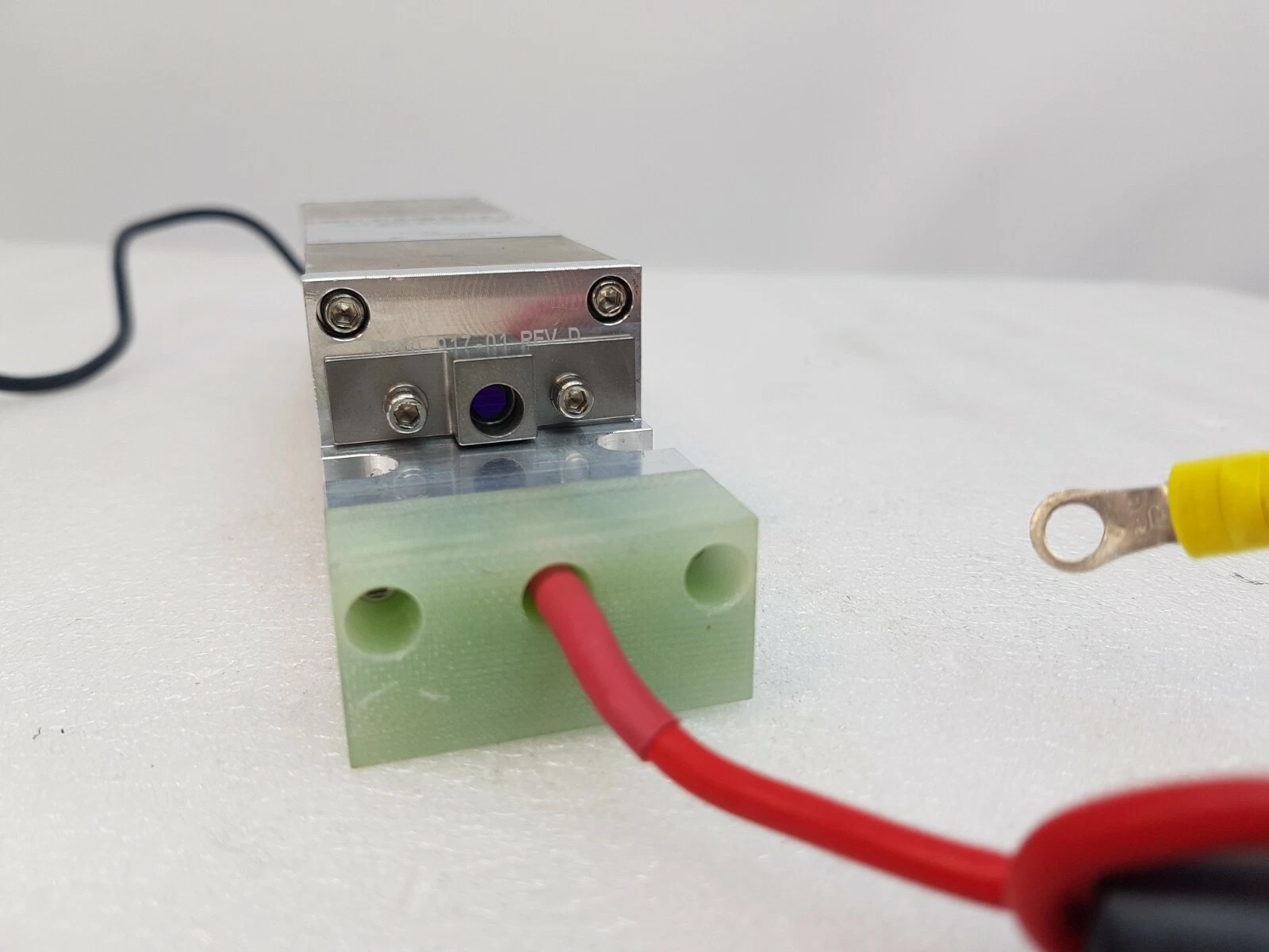 Other end of the holmium brick with green block, red lead and optical aperture, REV D