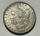1886 S MORGAN DOLLAR AU