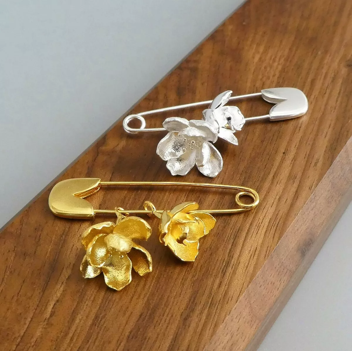Hanging brooch on sale