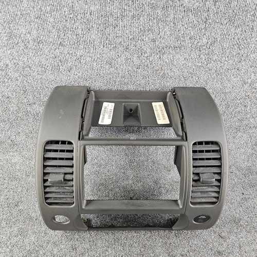 2005-2012 NISSAN XTERRA RADIO AC CLIMATE DASH PANEL BEZEL VENTS 68260-EA002 - Picture 2 of 5