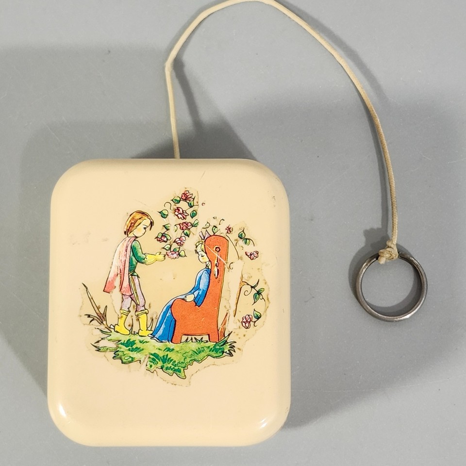 A pull-string lullaby music box that's charmingly off-tune — its imperfect, haunted melody gives it an irresistible character no new toy can replicate.
