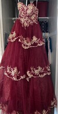 Quince/Prom dress, red and gold, size 0,has a corset, has mini hoop and sleeves 
