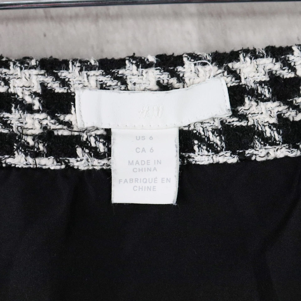 Minifalda H&M para mujer talla 6 negra blanca boucle pata de gallo tweed bolsillos delanteros Foto 2 de 4