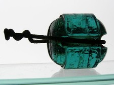 CD 1138 [10] No embossing Johnny Ball, dark aqua glass insulator, short length