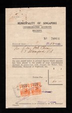 1946 Municipality of Singapore receipt, affixed BMA 2cx2, both with SMC perfins.