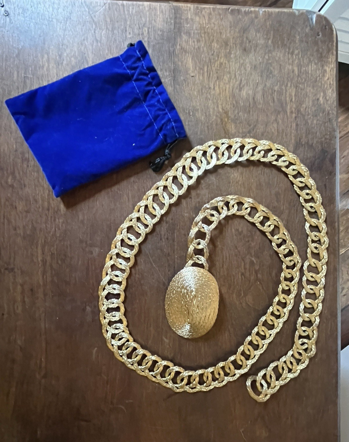 Gold-tone woven wire link belt with circular buckle