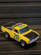 Yellow AFX Datsun pick-up  211  Non-mag chassis