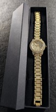 Light Gold Ladies Watch With Cubic Zirconias On Bracelet And Around Bezel.