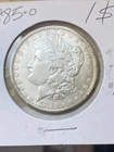 1885 O Morgan Silver Dollar. AU/BU. Some Rim Toning. No Reserve