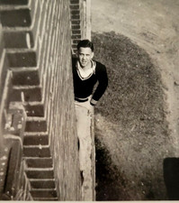 c1920s Man in Sweater On Balcony of Brick Building Hello Up There Photo