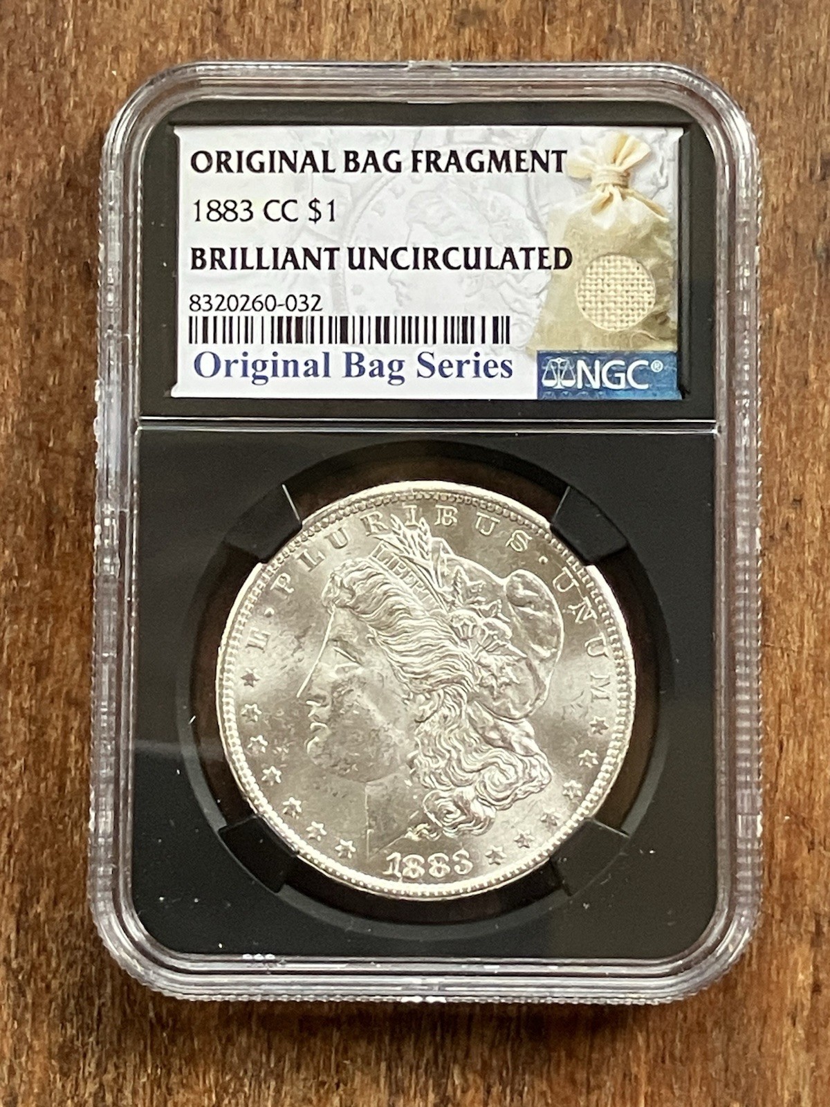 1883 CC Morgan Silver Dollar Original Bag Fragment NGC Brilliant Uncirculated SP