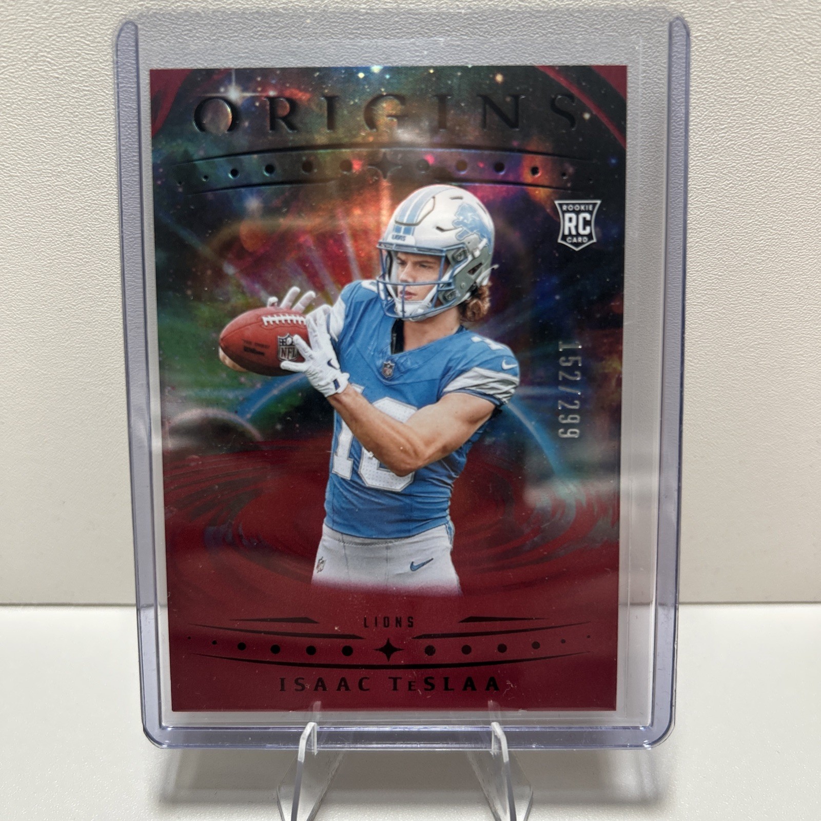 2025 Panini Origins - Rookies Isaac Teslaa, Isaac Teslaa #118 Holo Red /299 (RC)