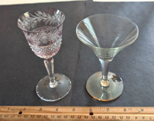 2 Different Fancy Cordials, 1 with a cranberry tint, 1 with yellow tint @ Base.