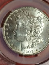 1902-0 MORGAN SILVER DOLLARS. CAC MS 62. FULL MINT LUSTER. CAC APPROVED.