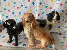 Assorted dog ornaments Black Coopercraft, Kingston pottery and one other .