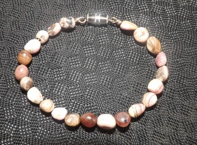 Handmade 7 inch bracelet with pink (+ matrix) 5-8 mm Rhodochrosite beads.