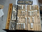 TWO TRAYS OF WATCH PARTS IN SMALL TUBES + 3 SMALL BOXES OF WATCH PARTS