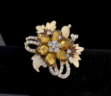 Faceted Gold Rhinestone and Clear Rhinestone Brooch with White Enamel Leaves
