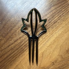 Vintage Art Deco Celluloid Hair Comb. Green rhinestone in black finish.