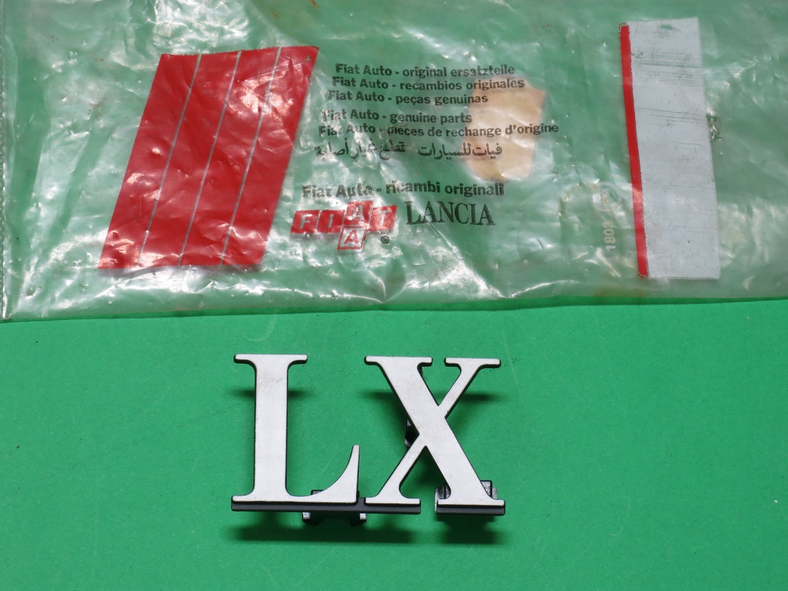 Scritta Fregio Logo Badge Griglia Mascherina Calandra Radiatore Lancia Delta Lx - Immagine 1