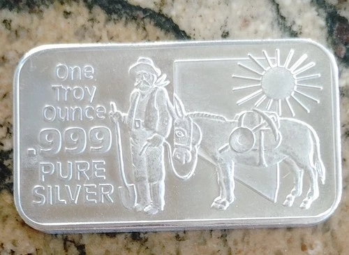 1980 NEVADA COIN MART PROSPECTOR AND BURRO 1 OZ. SILVER BAR