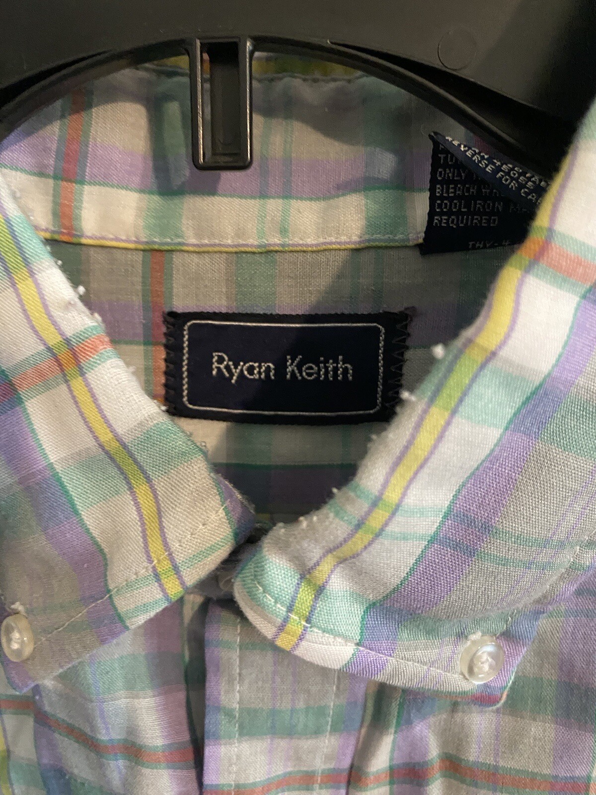 Men’s long-sleeve button-up shirt with pastel plaid pattern, featuring a black Ryan Keith label on the inner collar.