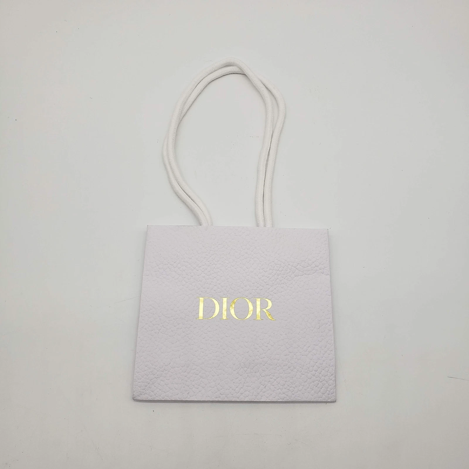 Sac cadeau shopping petit texture papier caillou Dior   NEUF or blanc