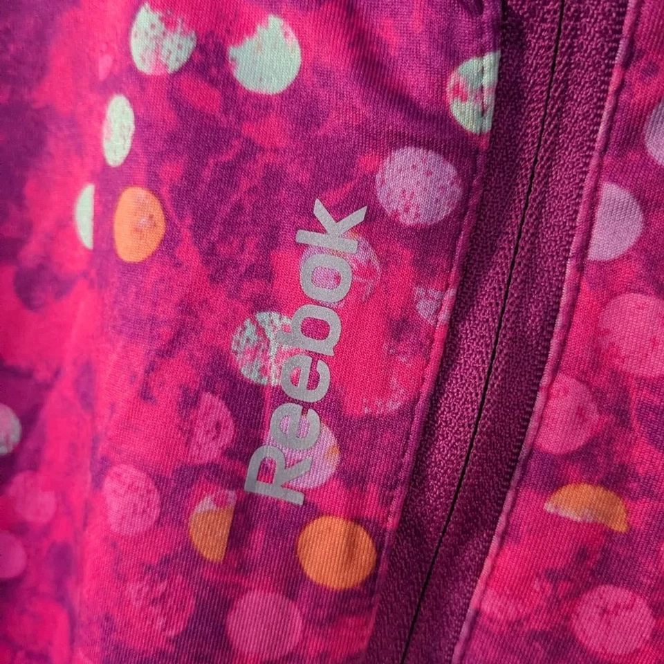 Chaqueta deportiva Reebok para mujer talla M 1/4 cremallera top rosa naranja lunares reflectores Foto 2 de 4