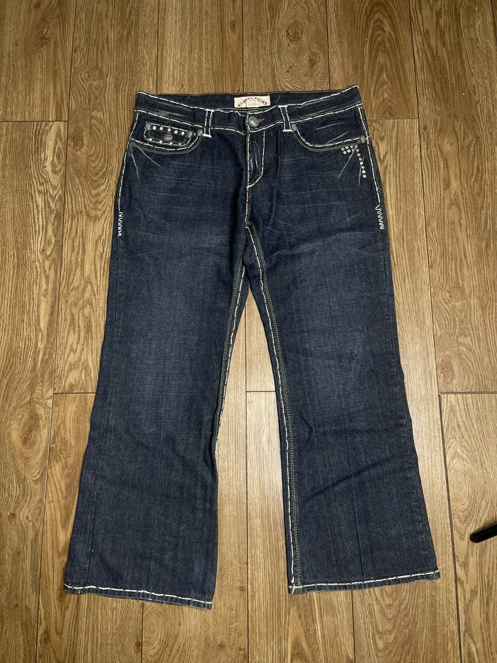 Jeans de playa vintage Y2K Laguna desgastados con tachuelas de calavera para hombre talla 38x30 Foto 2 de 4