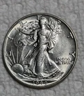 1944 P Walking Liberty Silver 1/2 Dollar. Estimated Almost Uncirculated 58. M102