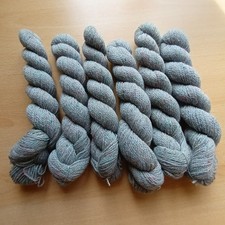 Pack of 2 ply yarn in 6 hanks of light grey shade with flecks