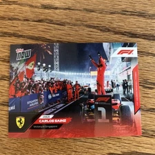 Carlos Sainz Ferrari 2023 Topps F1 Card #46 Victory in Singapore In Hand