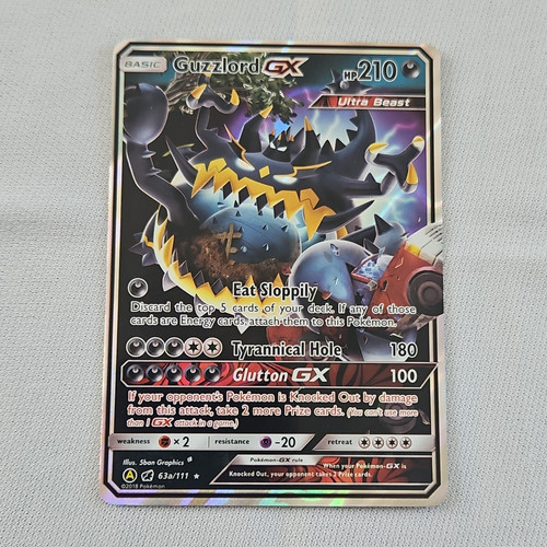 The Pokémon Company Guzzlord GX 63a/111 Crimson Invasion Holo UR ENG 210HP