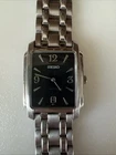 Seiko Men 28mm Watch. 7N39-5B68 (or 5B20) R1. Silver Tone. Black Dial. Date