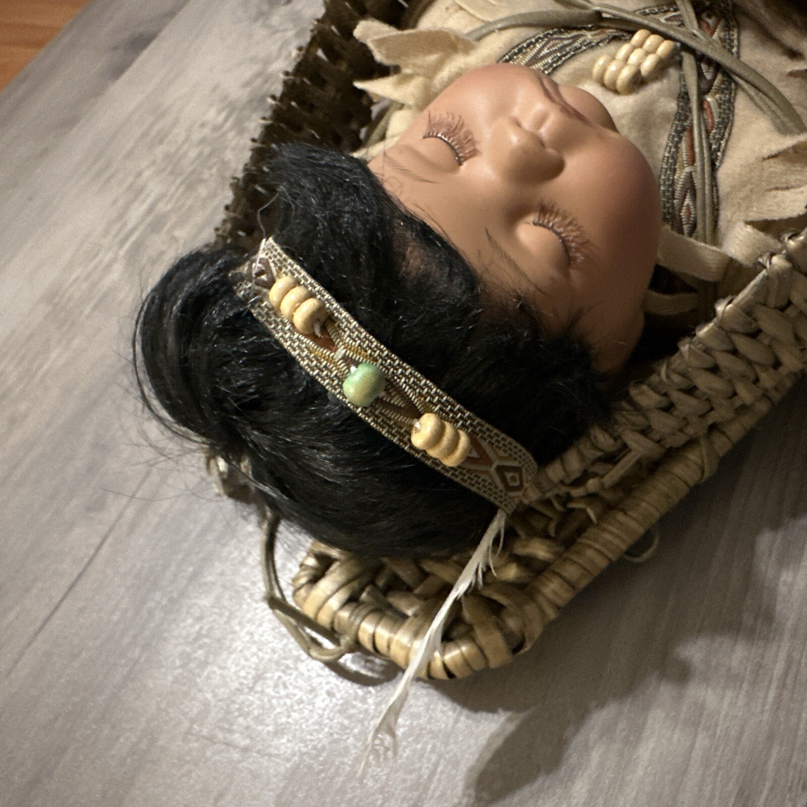 VINTAGE NATIVE AMERICAN INDIAN PAPOOSE PORCELAIN BABY DOLL IN WICKER