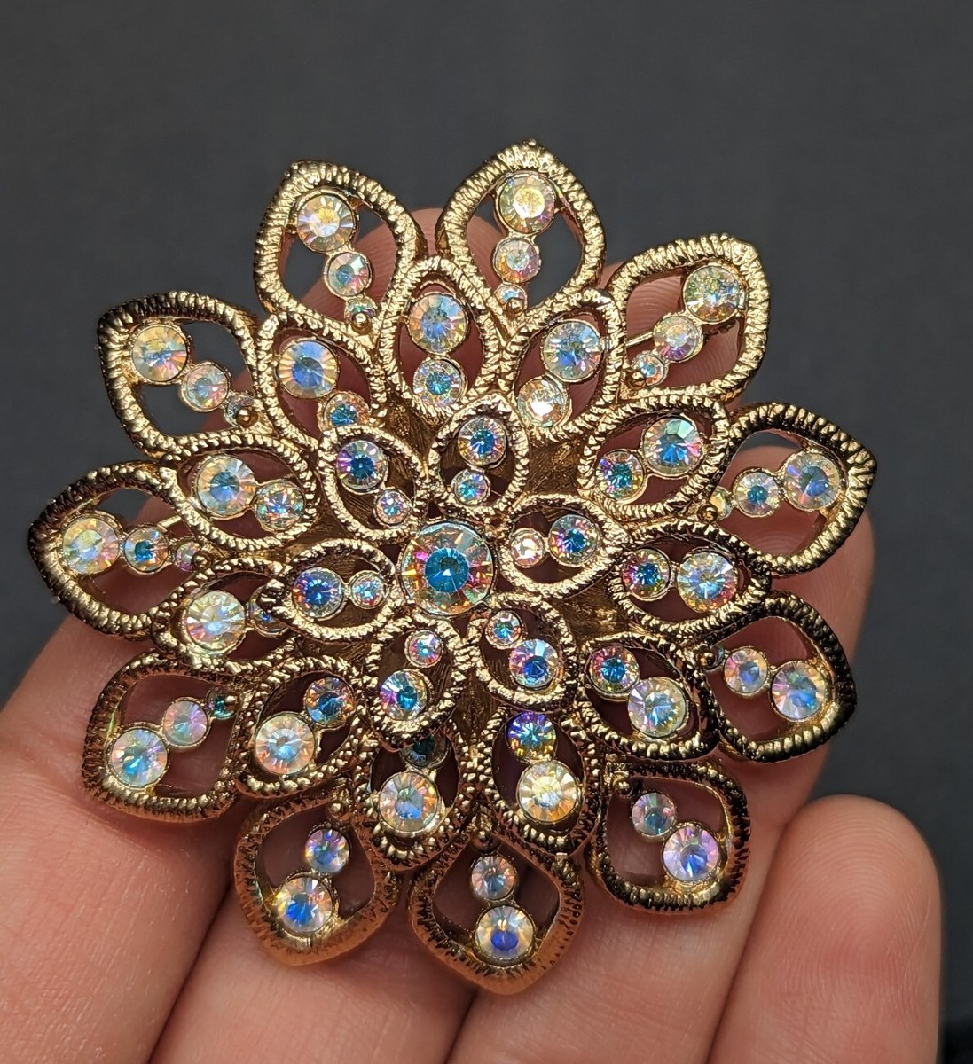 St John Signed AB Aurora Borealis Gold Tone Rhinestone Flower Brooch Pin
