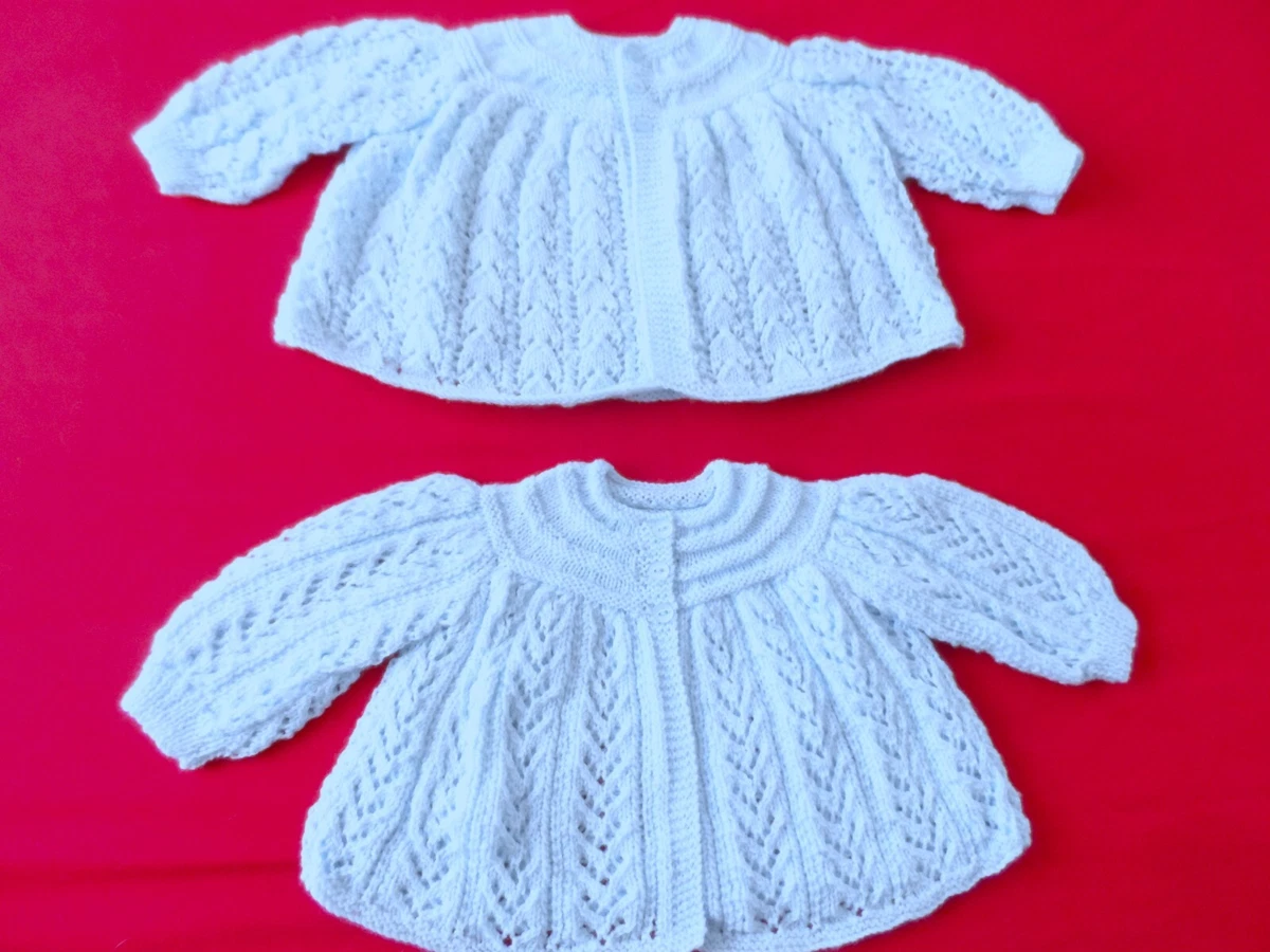TWO HAND KNITTED BABY MATINEE COATS IN PALE BLUE. 18