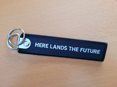 Schlüsselanhänger ''Here lands the future'' - blau, neu, remove before flight
