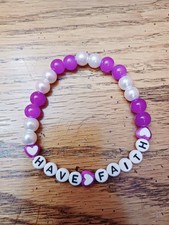 Pretty bracelet with purple and light pink glass 10mm beads. New.