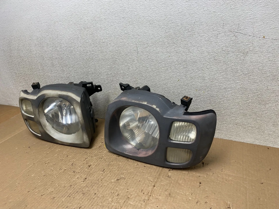 Faros laterales izquierdo+derecho Nissan Xterra 2002 2003 2004 OEM T7660 DW Foto 3 de 4